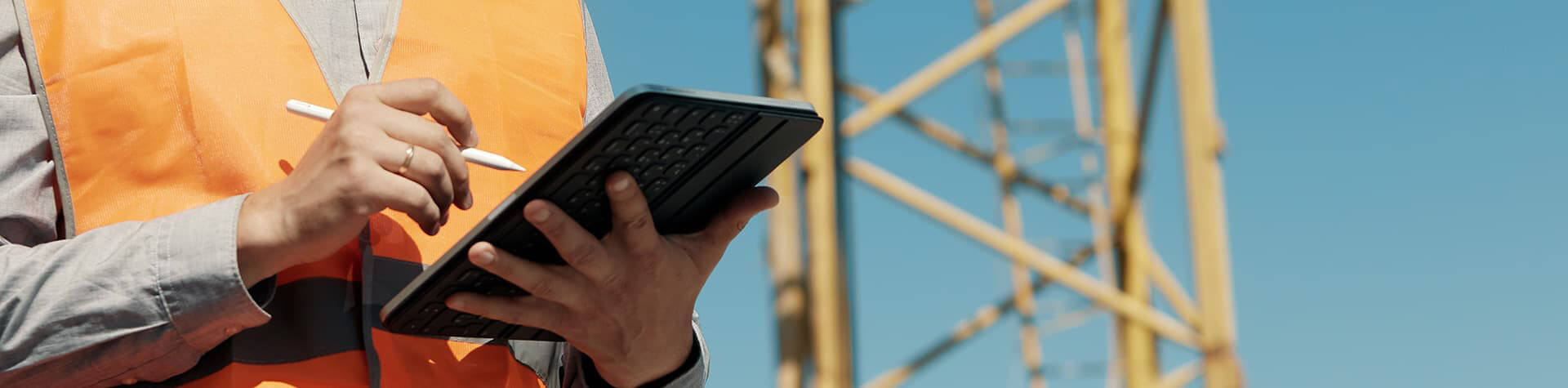 Utility worker with iPad on jobsite
