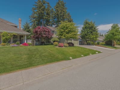 Field worker using a mobile phone with aerial photo of site.