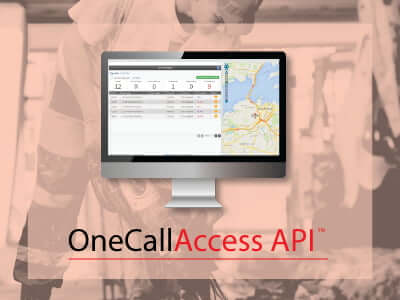 Field worker using a mobile phone with aerial photo of site.