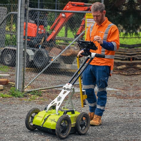 Technician surveys with ground penetrating radar